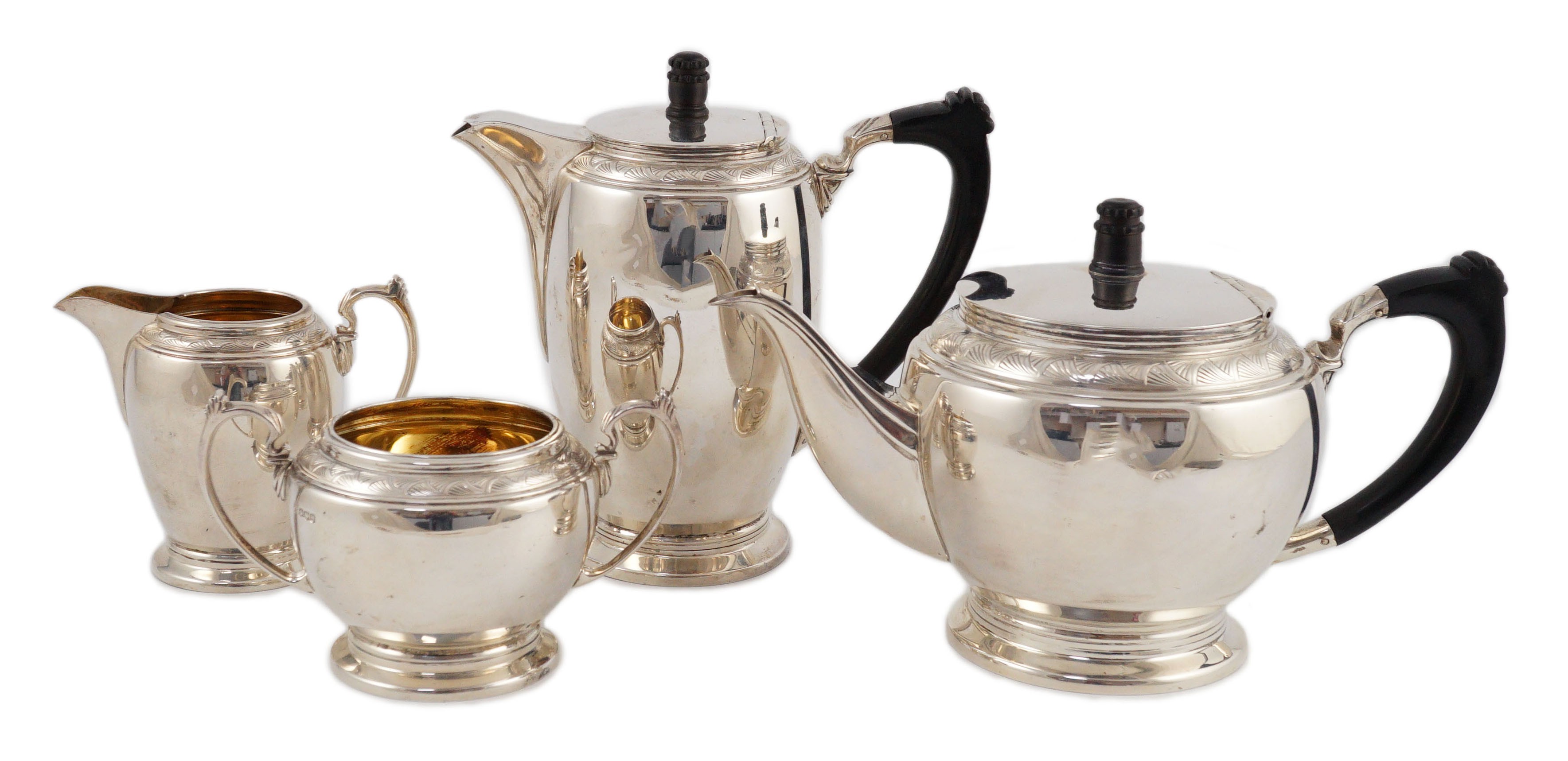 A George VI four piece silver tea set, by Harrods Ltd